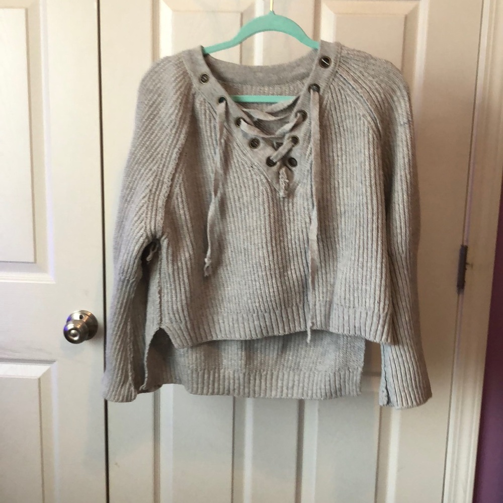 This is a grey V-neck sweater